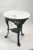 A marble topped table with cast iron base,