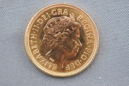 An Elizabeth II full sovereign coin, dated 2000.