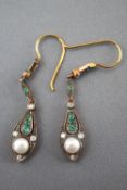 A pair of drop earrings set with emeralds,