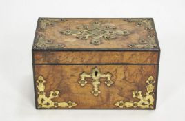 A Victorian walnut tea caddy with Gothic style gilt metal mounts,