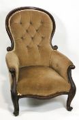 A Victorian mahogany show wood frame armchair with button back on cabriole legs,