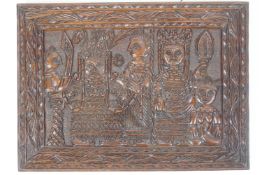 A Nigerian carved plaque to celebrate Coronation of Akenzuo II,