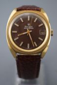 A gold-plated Bulova accutron wristwatch. Circular brown dial with baton markings and date feature.