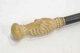 An ebonised walking stick with Victorian style double handle,