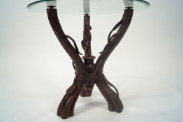 A Black Forest carved wood tripartite table stand realistically carved as branches,