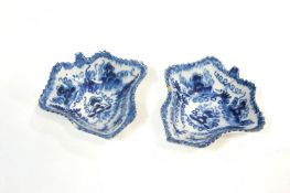 A pair of 18th century English porcelain pickle dishes, painted in under glaze blue with grapes,