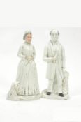 A pair of Staffordshire pottery figures of the Gladstones, picked out in gilt,