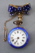 A gold-plated fob watch with blue enamelled finish.