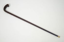 A hardwood walking stick with hardwood handle,