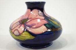 A Moorcroft magnolia pattern low baluster vase,