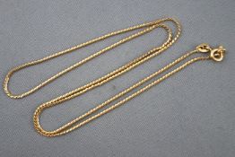 A yellow metal serpentine link chain, bolt ring clasp, 500mm. Stamped 750 for 18ct gold.