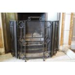 A wrought iron triple fire guard,