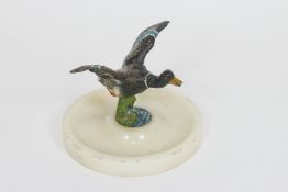 A cold painted bronze of a mallard in full flight,