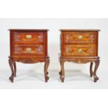 A pair of mahogany bed side tables, each with two drawers, on cabriole legs,