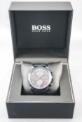 A blue stainless steel Hugo Boss wristwatch. Quartz movement.