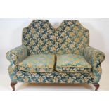 A Queen Anne style sofa with double arched back and two loose cushions, on cabriole legs,