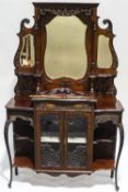 A Victorian mahogany elaborate display cabinet in the Rococo style,
