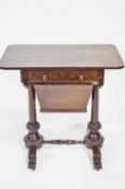 A Victorian rosewood work table, with fitted frieze drawer above the wool box,