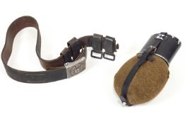 A Third Reich Infantry belt with four tabs and an aluminium buckle with a water bottle.