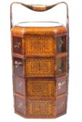A Chinese marriage basket, of woven bamboo, carved hardwood and verre eglomise,