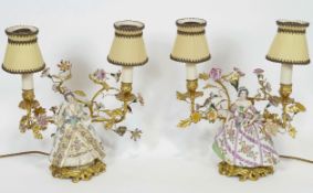 A pair of gilt metal and porcelain lamps,