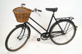 A Ladies 1930's/40's Raleigh bicycle, in black, fitted with front wicker basket,