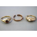 A collection of three yellow metal rings to include: A single stone pearl ring,