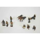 A group of late WWII cast metal American model soldiers, to include two African Americans,