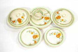 A Clarice Cliff part dinner service, comprising two tureens and covers,