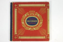 A German album of pre war cigarette cards showing uniforms