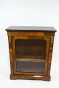 A Victorian walnut and marquetry pier cabinet, with gilt metal mounts around one glazed door,