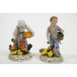 Two polychrome decorated Meissen style hard paste porcelain Dresden figures