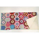 A 1950's hand stitched patchwork quilt,