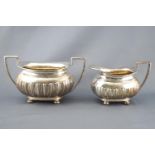 A silver four piece tea service, of rounded rectangular lobed form,