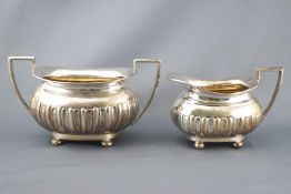 A silver four piece tea service, of rounded rectangular lobed form,