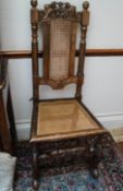 A Daniel Marot style chair with caned back and seat,