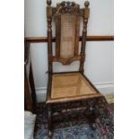 A Daniel Marot style chair with caned back and seat,