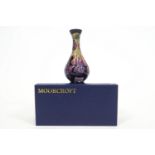 A Moorcroft collectors vase in the fuchsia pattern,