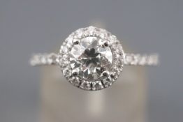 A white metal diamond cluster ring.
