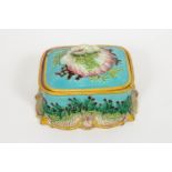 A majolica butter dish and cover, modelled with a shell and seaweed knop,