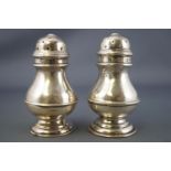 A pair of silver peppers and salts, the peppers of plain George I baluster form, London 1902,