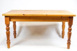 A rectangular pine kitchen table,