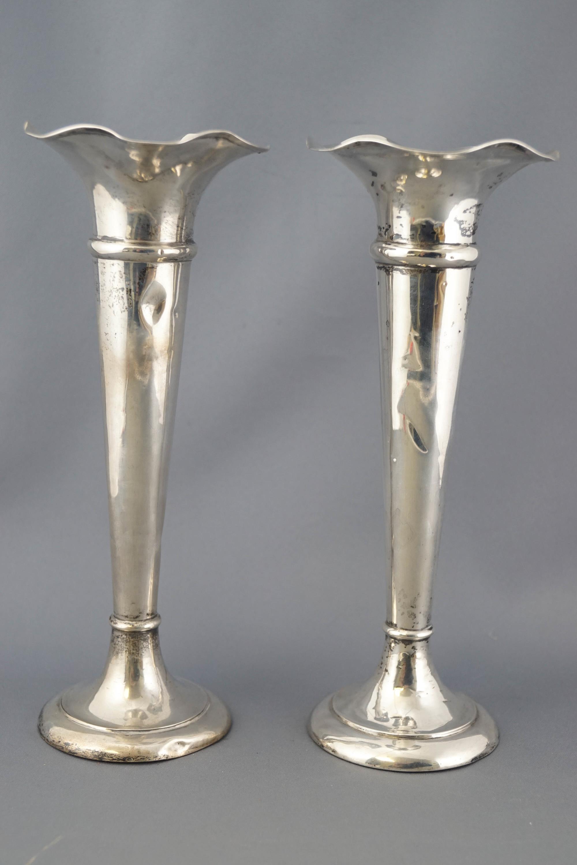 A pair of silver spill vases, of tapered trumpet form with waving edges, Birmingham 1905,