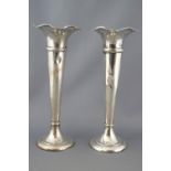A pair of silver spill vases, of tapered trumpet form with waving edges, Birmingham 1905,