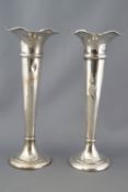 A pair of silver spill vases, of tapered trumpet form with waving edges, Birmingham 1905,