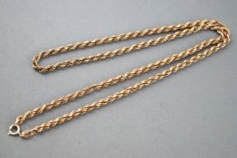 A yellow metal twisted rope link chain, bolt ring clasp, 580mm.