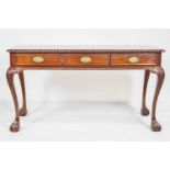 A mahogany desk in George III style, with three frieze drawers,