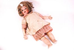 A 19th century porcelain doll with porcelain sleeping eye, head numbered 32,