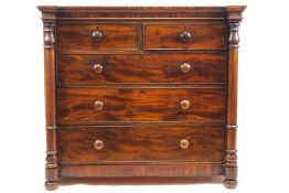 A Victorian mahogany chest of two short and three long drawers with turned handles and turned