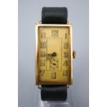 A rolled gold wristwatch. Rectangular hinged case. Manual wind (unsigned) movement.